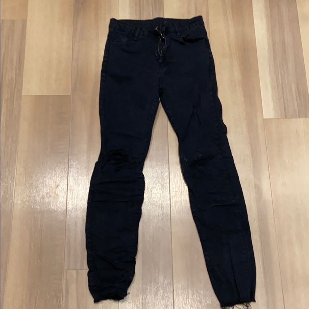 Distressed black ripped skinny jeans